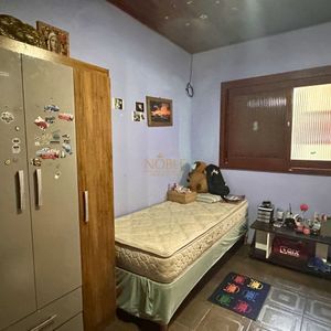 Casa, 3 dormitórios, 2 vagas no bairro Centro em Torres para Comprar