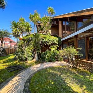 Casa, 4 dormitórios, 2 suítes, 3 vagas no bairro Praia Grande em Torres para Comprar