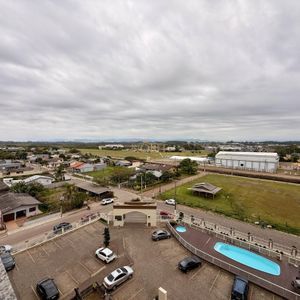 Apartamento com 59m², 2 dormitórios, 1 suíte, 1 vaga no Residencial Jardim Europa em Torres para Comprar