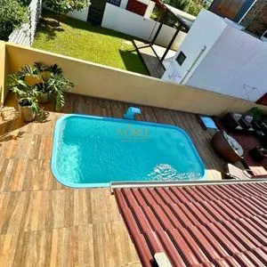 Casa com 108m², 2 dormitórios, 2 vagas no bairro Capão do Cravo em Passo de Torres para Comprar