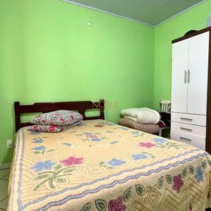 Casa com 101m², 2 dormitórios no bairro Igra Sul em Torres para Comprar