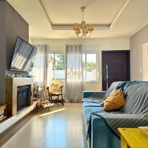 Sobrado com 350m², 4 dormitórios, 4 suítes, 2 vagas no bairro Centenário em Torres para Comprar