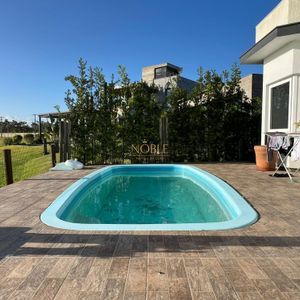 Casa de Condomínio com 260m², 3 dormitórios, 3 suítes, 4 vagas no Reserva das Águas em Torres para Comprar