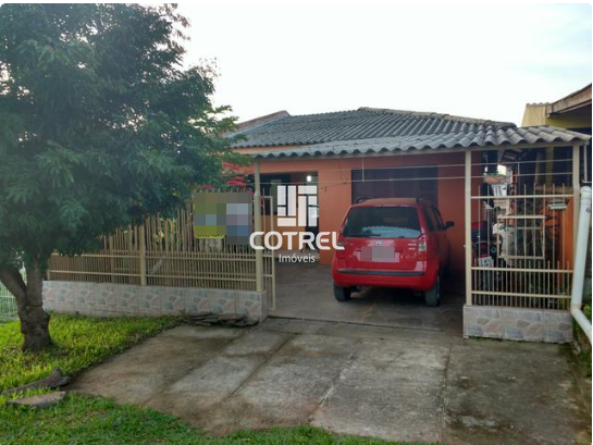 Casa 3 dormitórios e 2 vagas de garagem no Bairro Tancredo Neves localizada na c