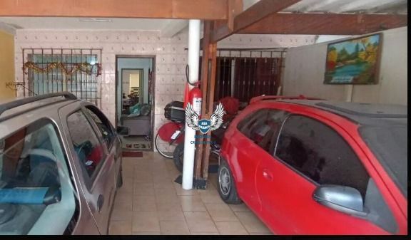 Casa térrea, com com 04 dormitórios e 03 vagas de garagem e uma edícula