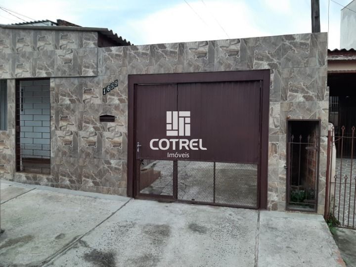 Casa 3 dormitórios e 2 vagas de garagem no Bairro Tancredo Neves localizada na