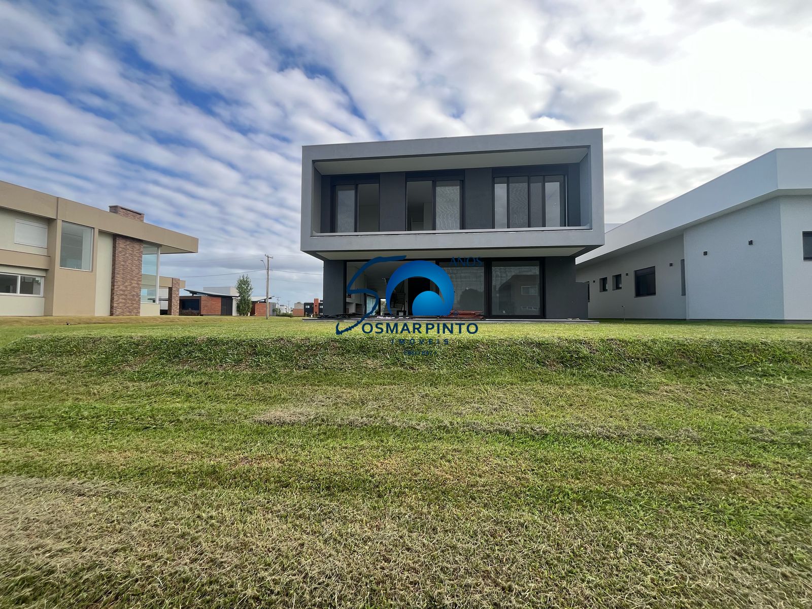 casa a venda em condominio torres rs
