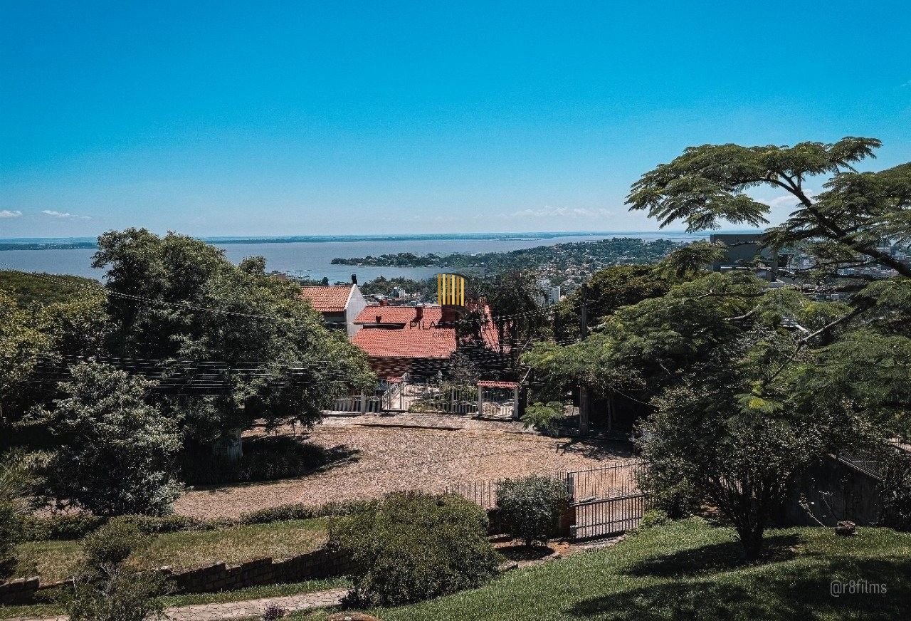 Casa bairro Sétimo Céu, 463m² privativos, vista privilegiada do Rio Guaíba em terreno de 1.423m². - Pilar Imóveis