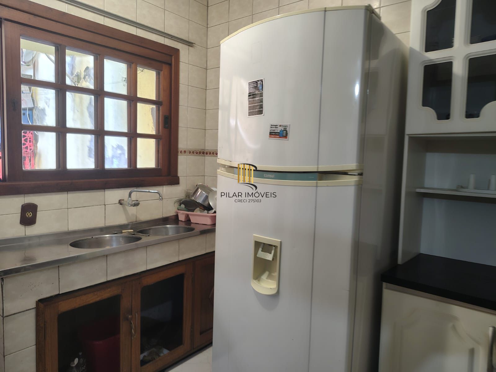 Casa de 4 dormitórios, 1 suíte e 4 vagas de garagem no bairro Cavalhada.