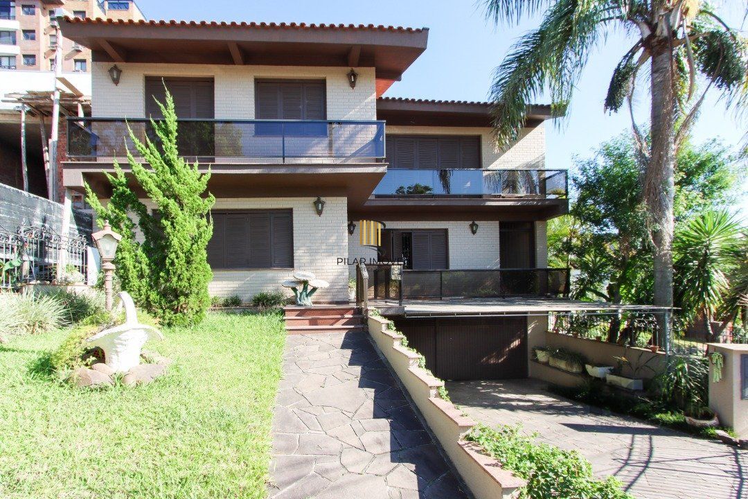 Casa a venda com 03 dormitórios, living 03 ambientes com vista para o Rio. - Pilar Imóveis