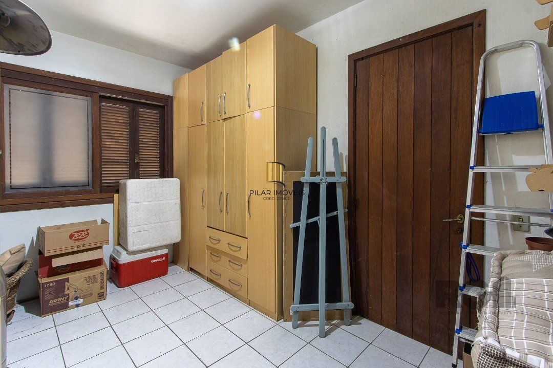 Casa de Condomínio 6 dormitórios no bairro Cavalhada