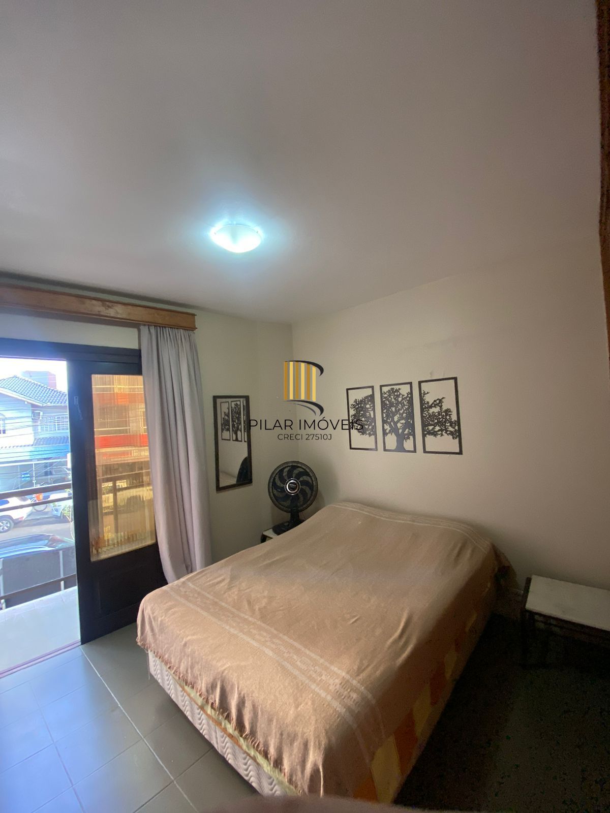 Apartamento com 2 dormitórios e garagem em Torres