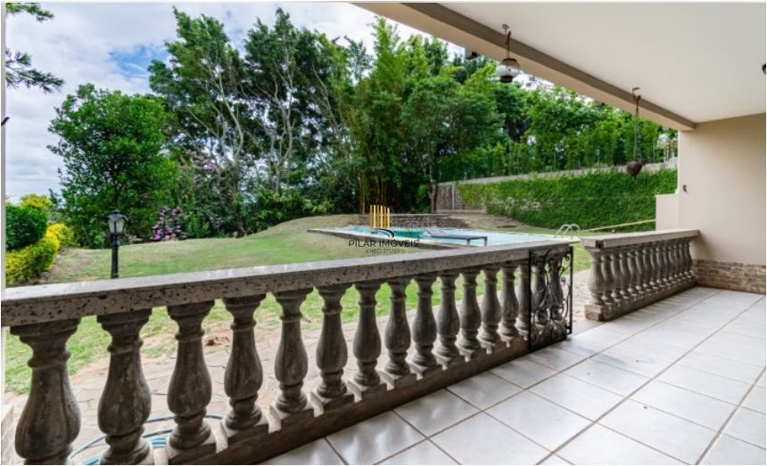 Casa em Condomínio à venda com 5 dormitórios, 565m² e 4 vagas no Condominio Jardim do Sol, Zona Sul de Porto Alegre