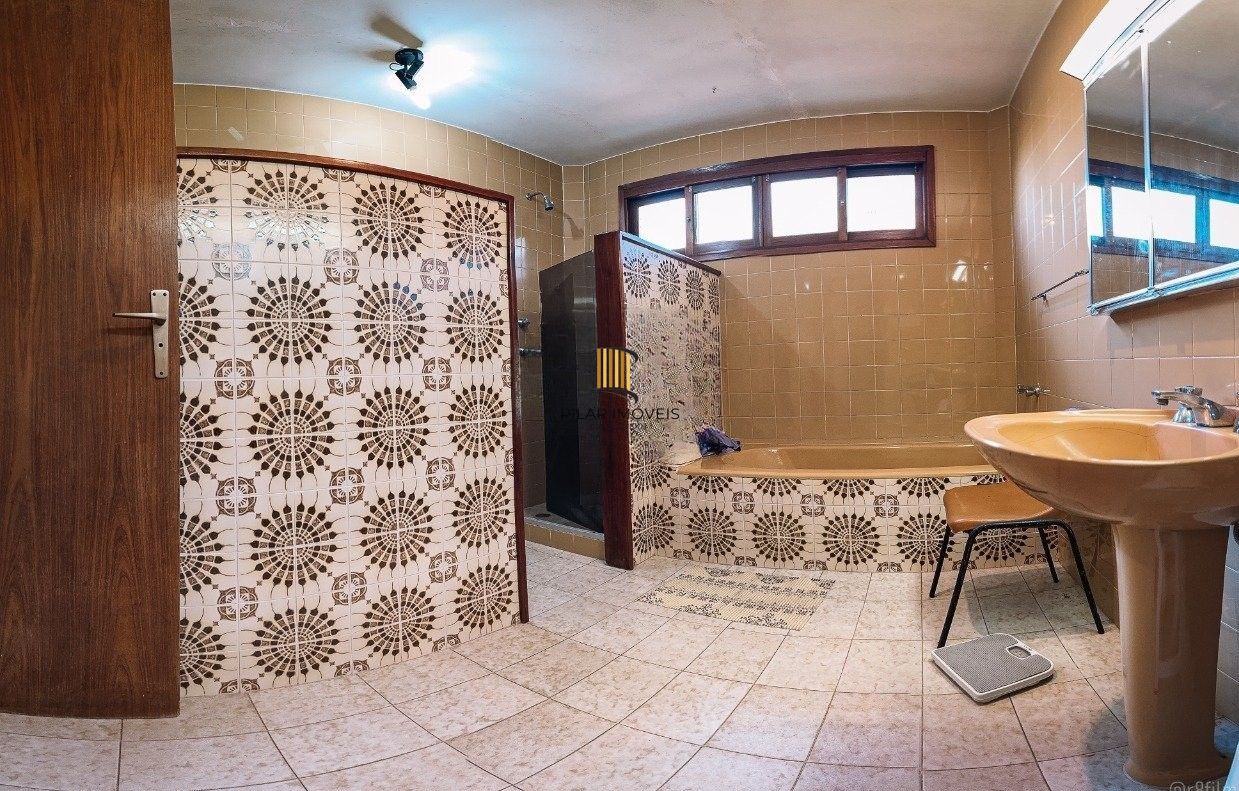 Casa bairro Sétimo Céu, 463m² privativos, vista privilegiada do Rio Guaíba em terreno de 1.423m².