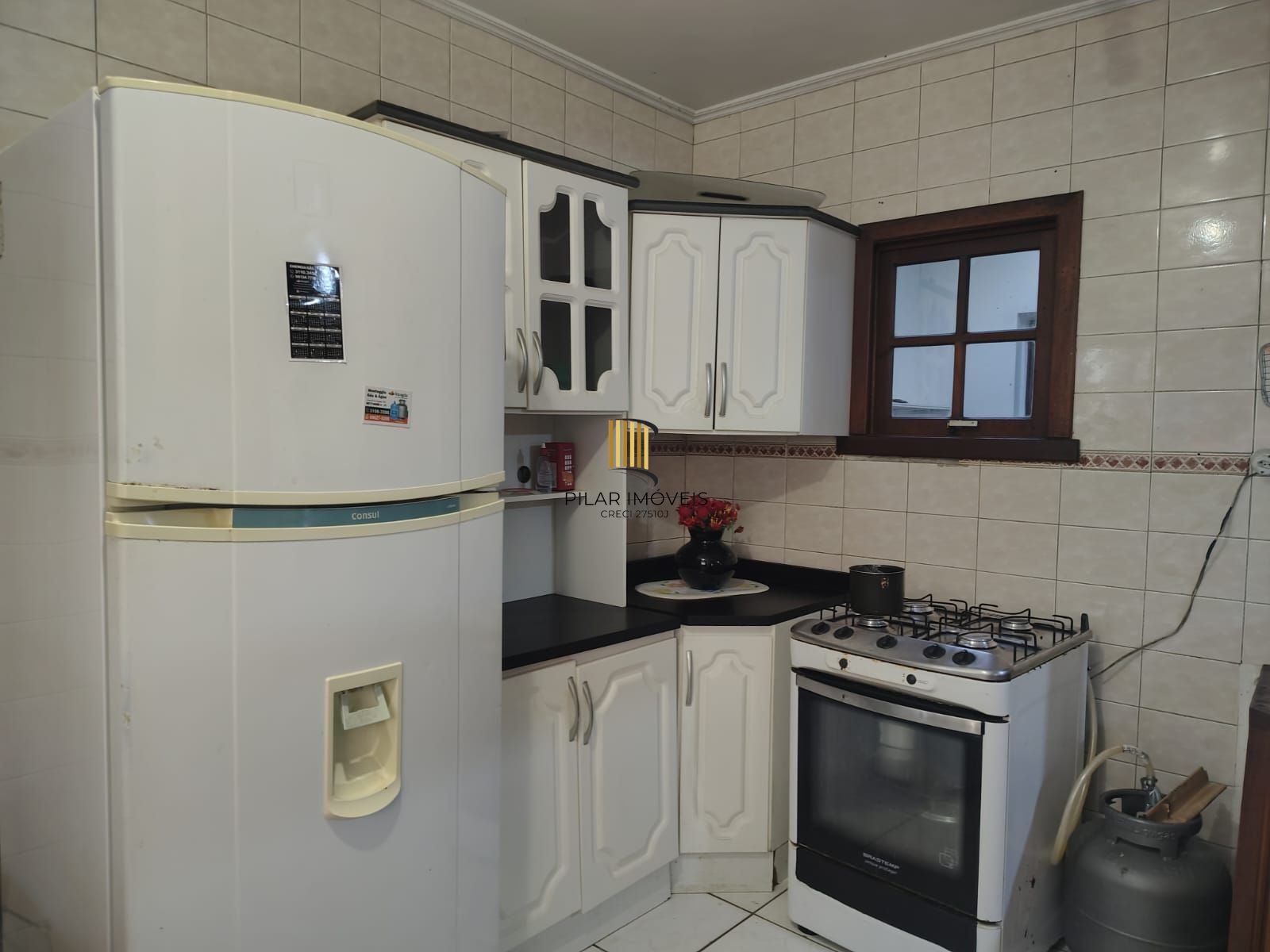 Casa de 4 dormitórios, 1 suíte e 4 vagas de garagem no bairro Cavalhada.