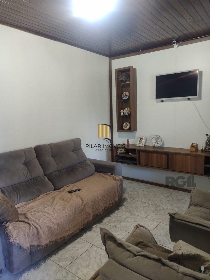Casa de 3 dormitórios, 1 suíte e 2 vagas de garagem em Viamão.