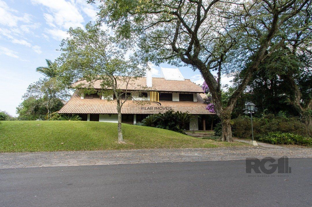Casa de Condomínio 6 dormitórios no bairro Cavalhada - Pilar Imóveis