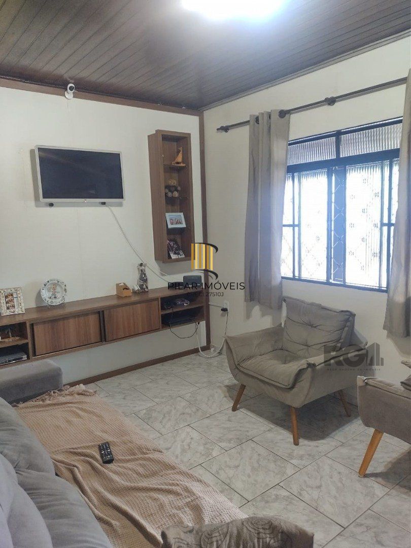 Casa de 3 dormitórios, 1 suíte e 2 vagas de garagem em Viamão.