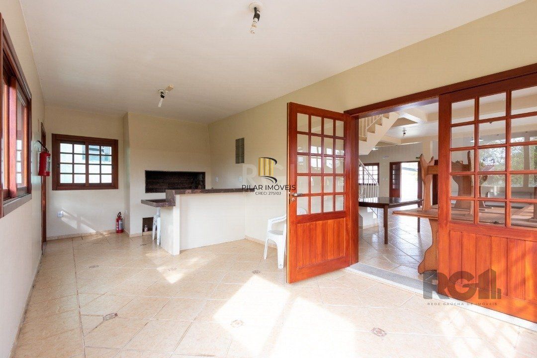 Casa de Condomínio 4 dormitórios no bairro Cavalhada