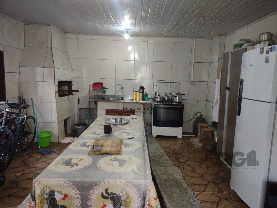 Casa 3 dormitórios no bairro Camaquã