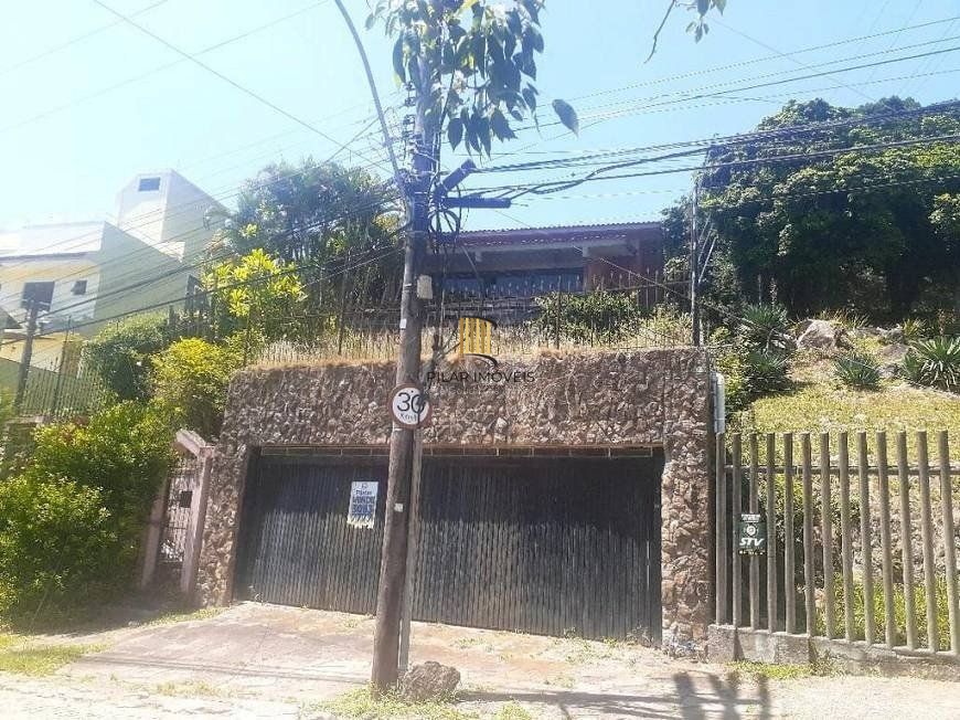 Casa 5 dormitórios no bairro Nonoai - Pilar Imóveis