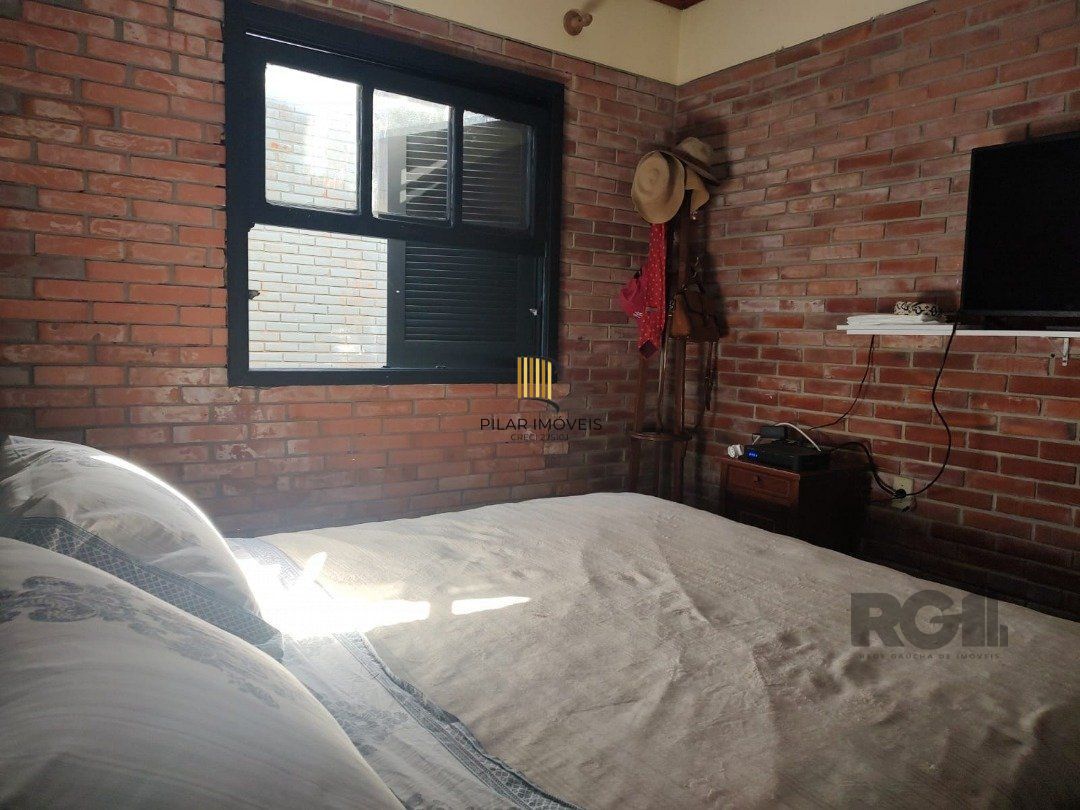 Casa 5 dormitórios no bairro Atlântida