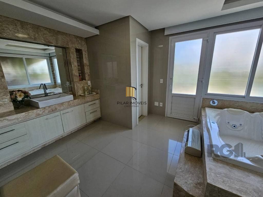 Casa de Condomínio 4 dormitórios no bairro Atlântida Sul