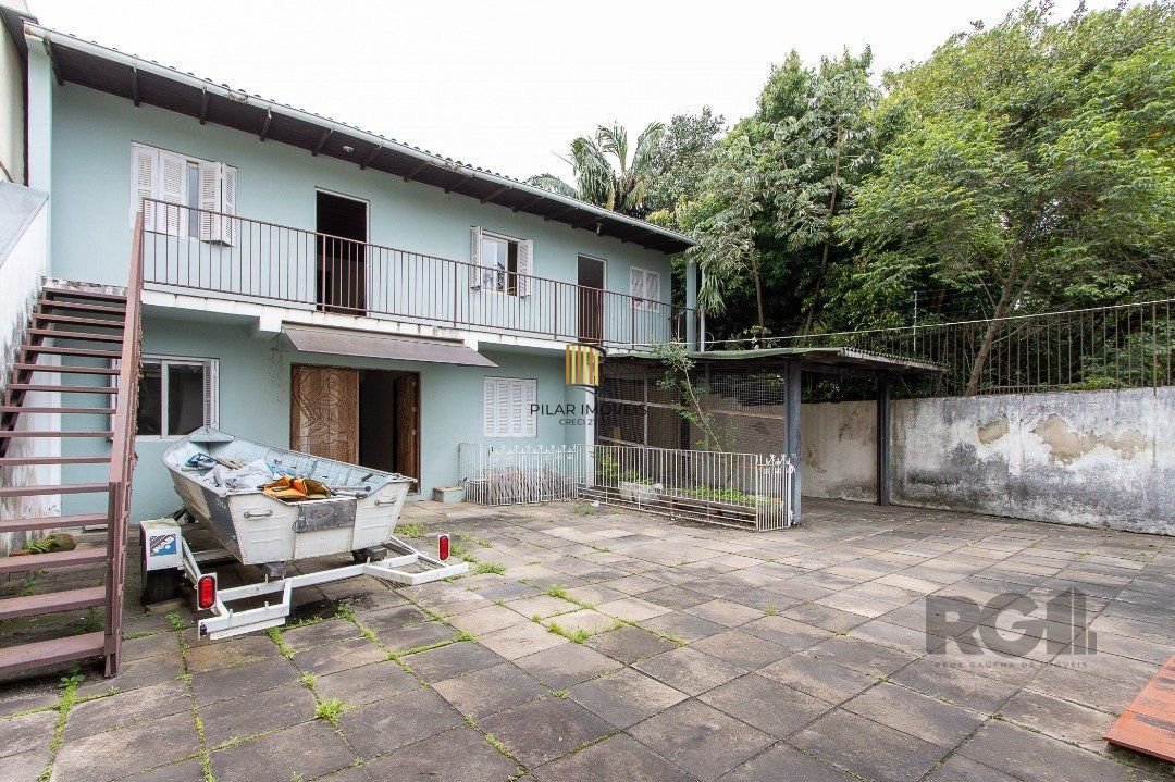 Casa 5 dormitórios no bairro Ipanema