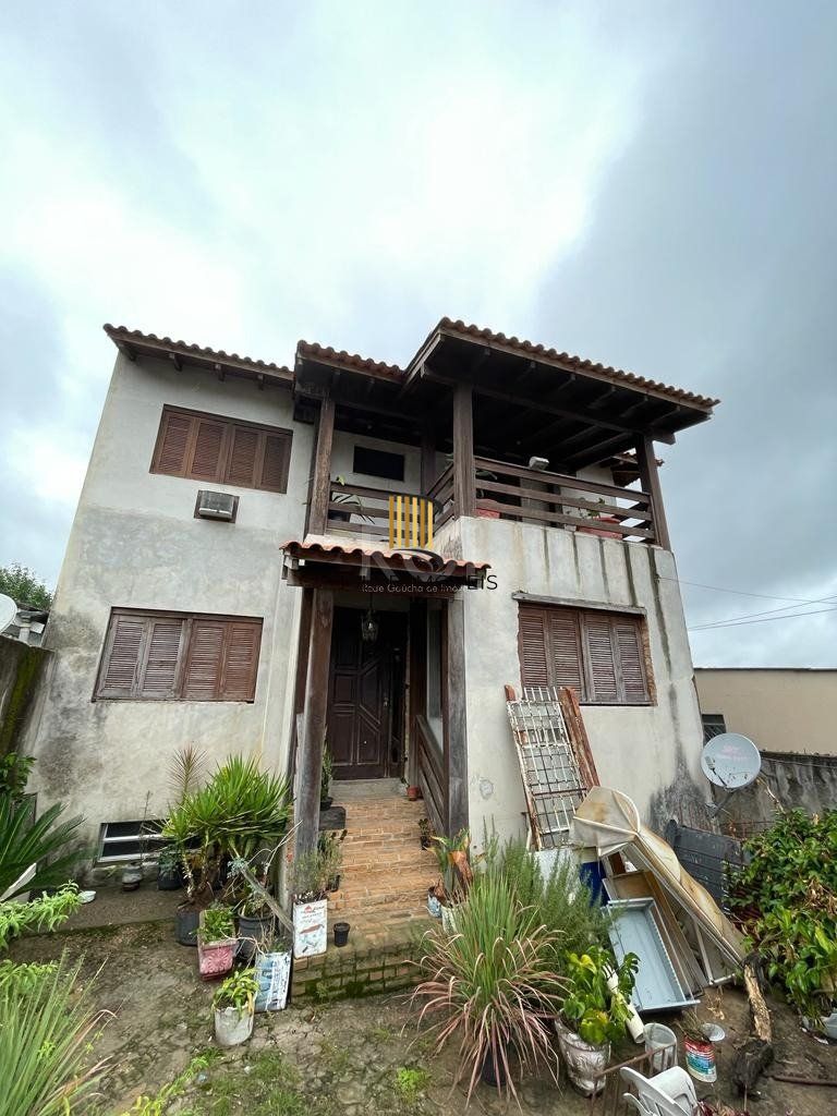 Casa 6 dormitórios no bairro Partenon
