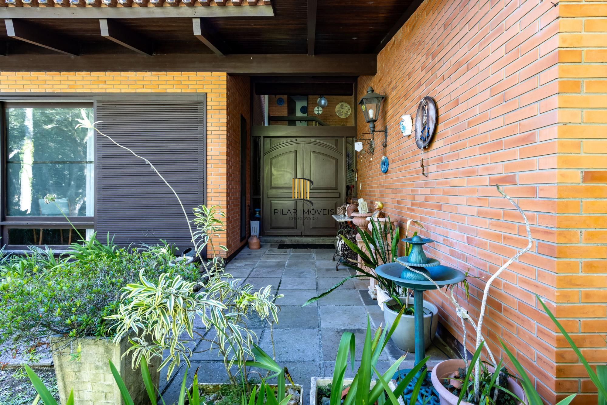 Casa de Condomínio 4 dormitórios no bairro Cavalhada