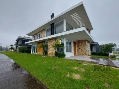 Casa de Condomínio 4 dormitórios no bairro Atlântida Sul