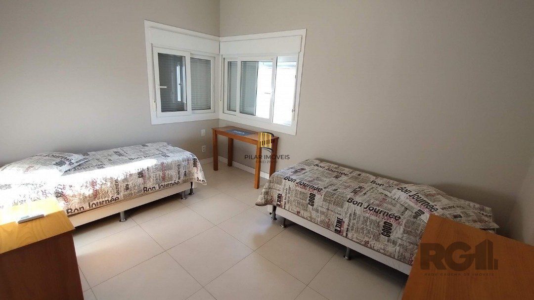 Casa de Condomínio 5 dormitórios no bairro Atlântida