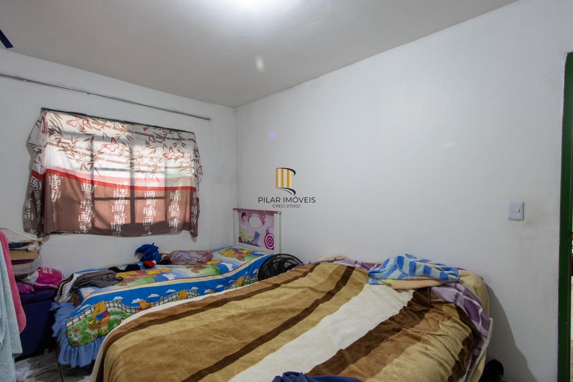 Casa ampla de 2 pavimentos com 4 dormitórios, 1 suite e 4 vagas no bairro Santa Tereza!
