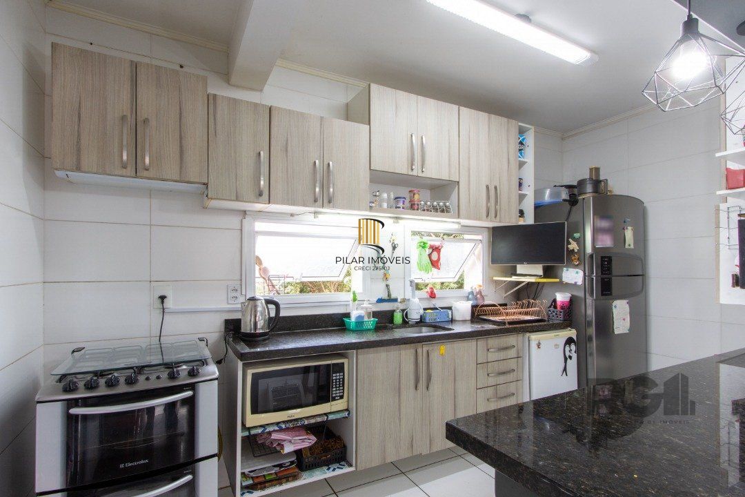 Casa 3 dormitórios no bairro Camaquã