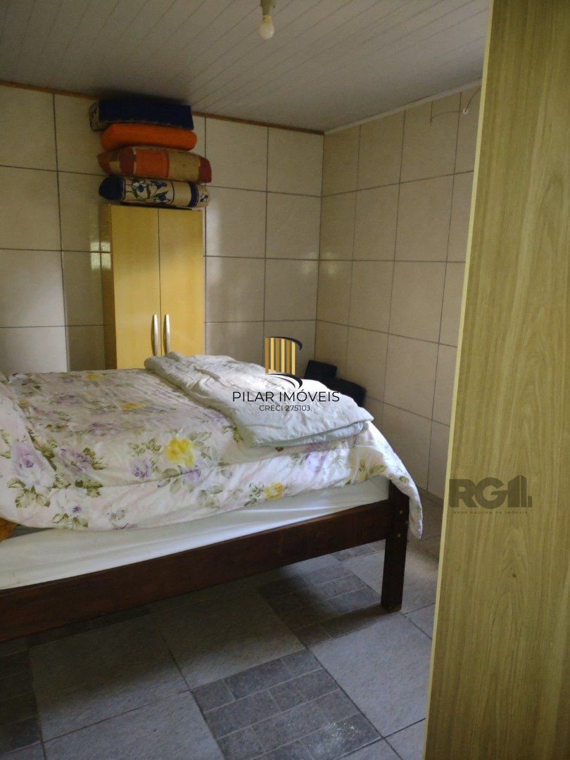 Casa 3 dormitórios no bairro Camaquã