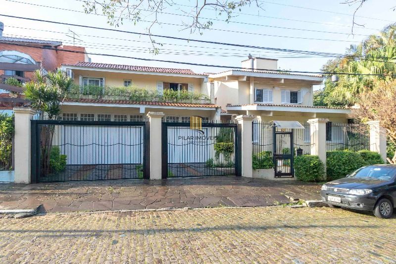 Casa para Venda - 420m², 5 dormitórios, sendo 2 suites, 6 vagas - Nonoai - Pilar Imóveis