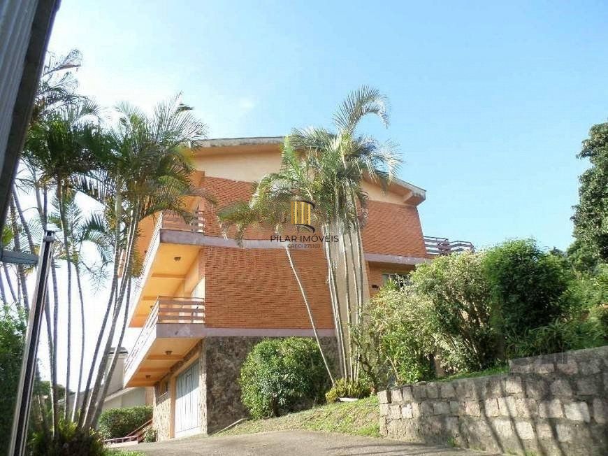 residência com vista panorâmica espetacular para o Guaíba em todos os cômodos da casa, hall de entrada, gabinete, lavabo, living para três ambientes com sacada e vista - Pilar Imóveis