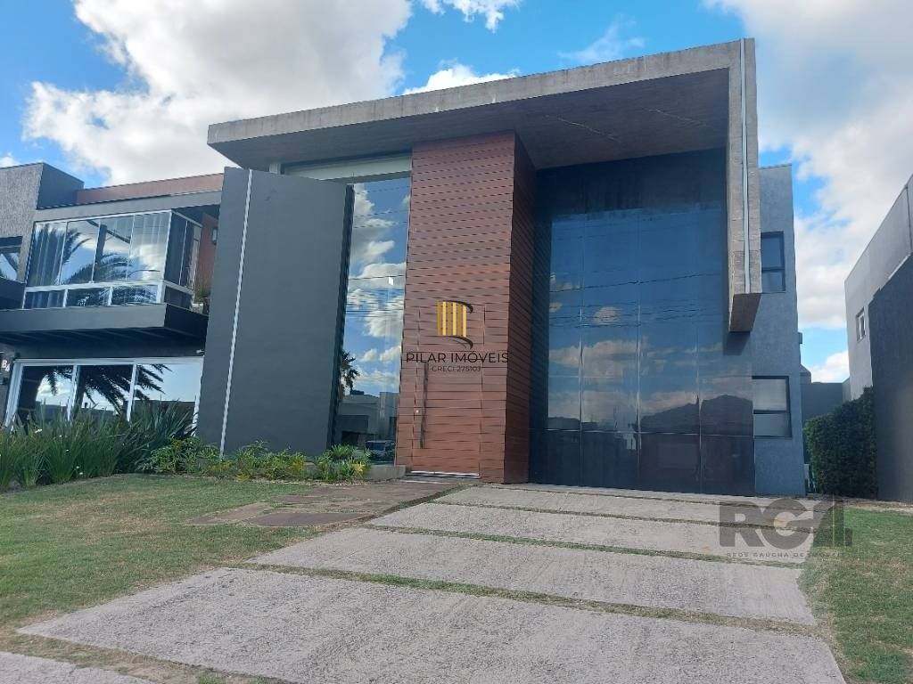 Casa de Condomínio 4 dormitórios no bairro Rainha do Mar
