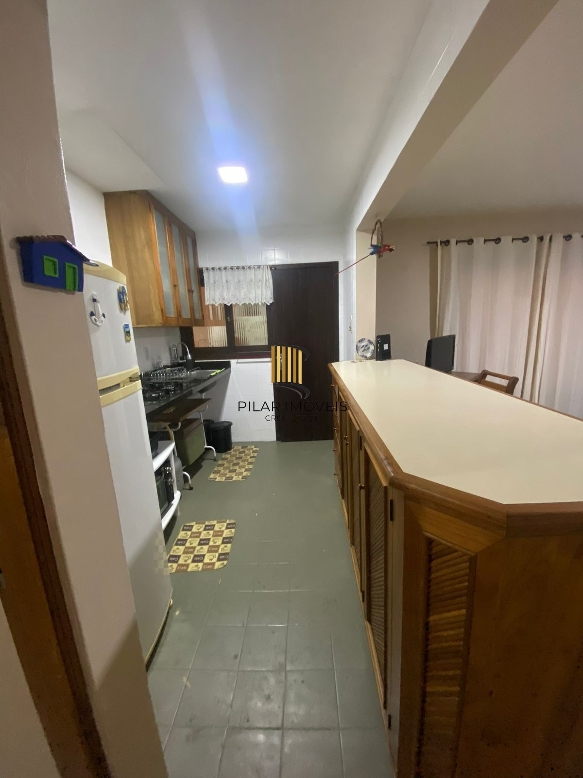 Apartamento com 2 dormitórios e garagem em Torres