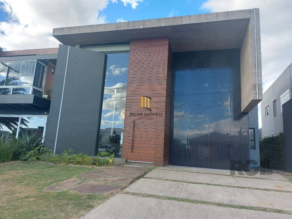 Casa de Condomínio 4 dormitórios no bairro Rainha do Mar