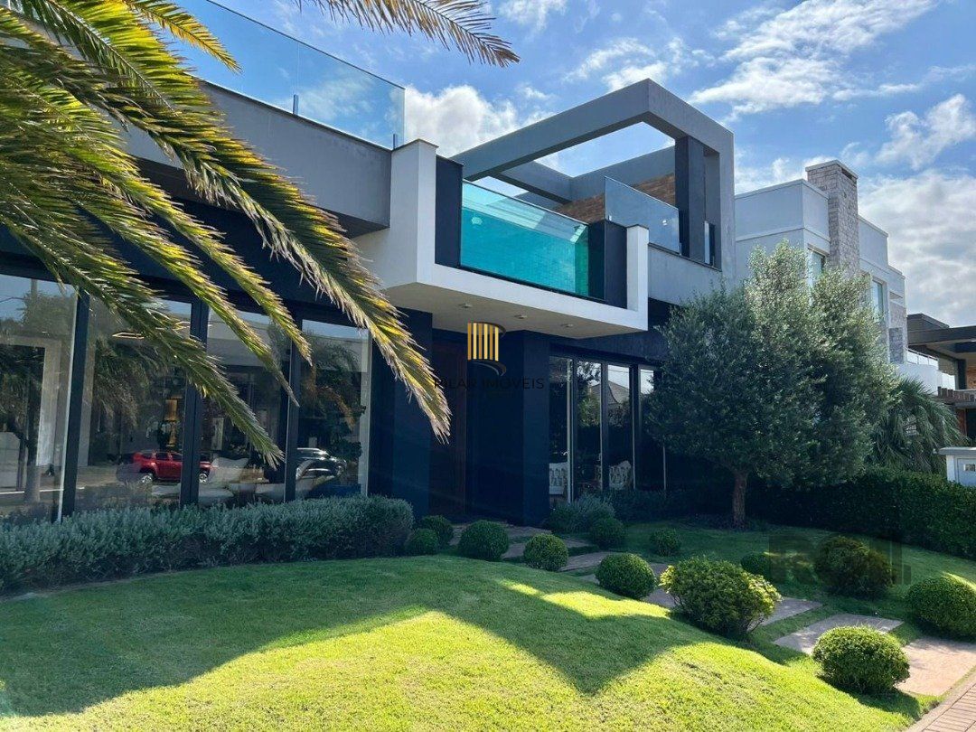 Casa de Condomínio 4 dormitórios no bairro Arroio Teixeira
