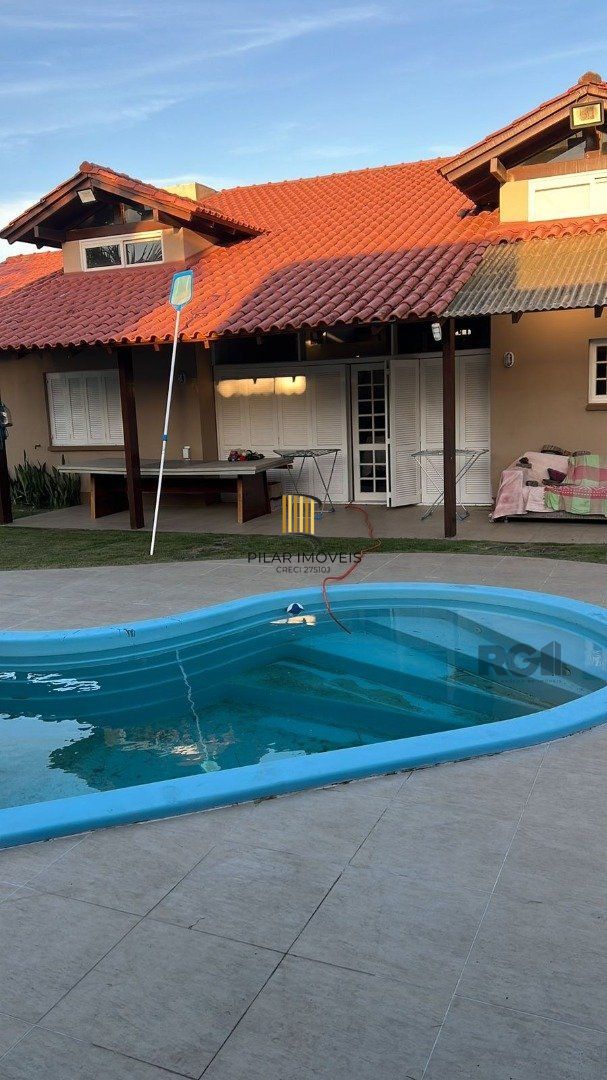 Casa 5 dormitórios no bairro Atlântida