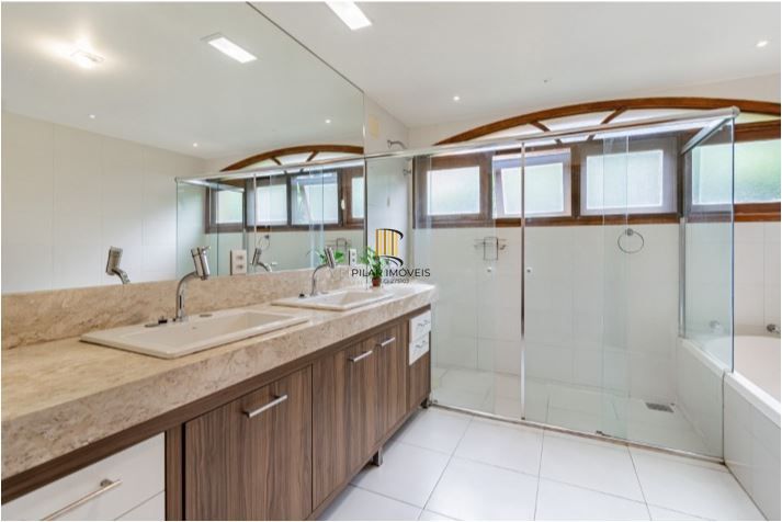 Casa em Condomínio à venda com 5 dormitórios, 565m² e 4 vagas no Condominio Jardim do Sol, Zona Sul de Porto Alegre