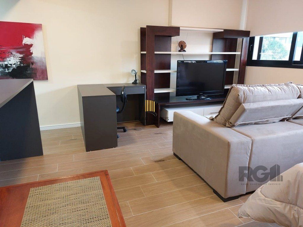 Apartamento stidio com 1 dormitório, 1 vaga de garagem no Bairro Auxiliadora.