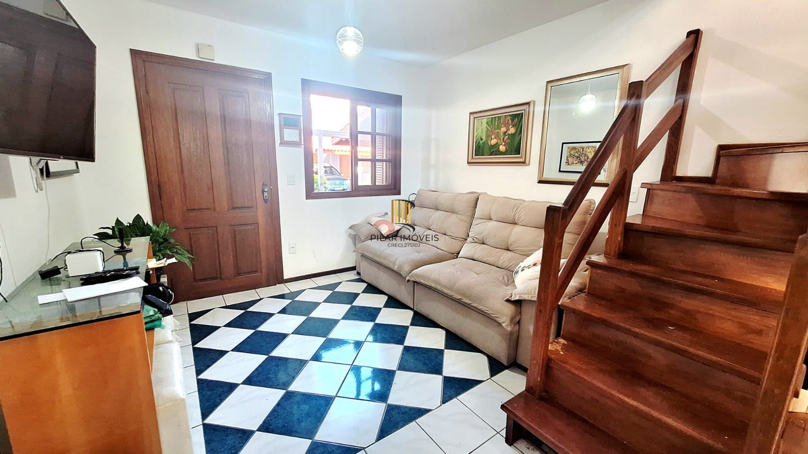 Casa com 2 dormitórios, 1 vaga, na Av. Otto Niemeyer, bairro Camaquã, Poa, RS