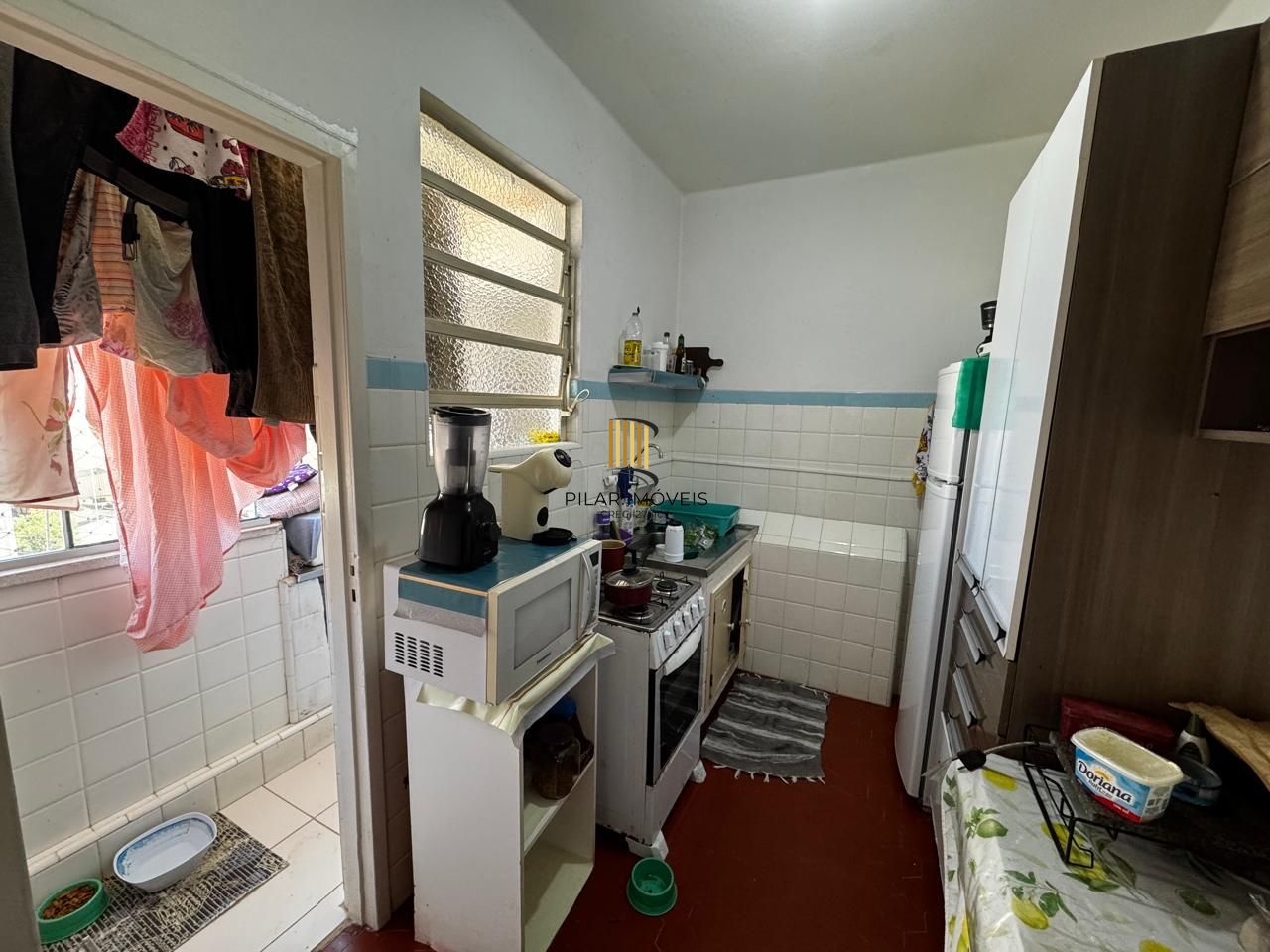 Apartamento de 2 dormitórios, fundos, andar alto.
