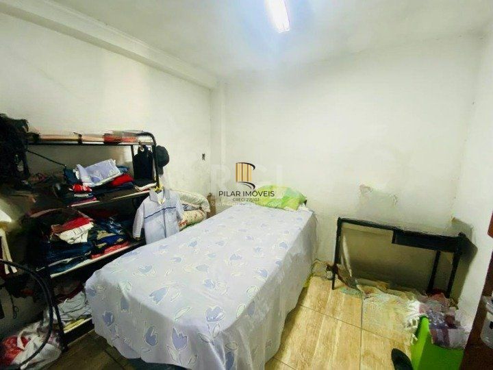 CASA BAIRRO CAMAQUÃ COM 4 DORMITORIOS