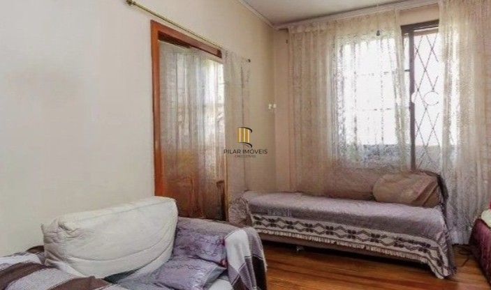 Casa 3 dormitórios no bairro Partenon
