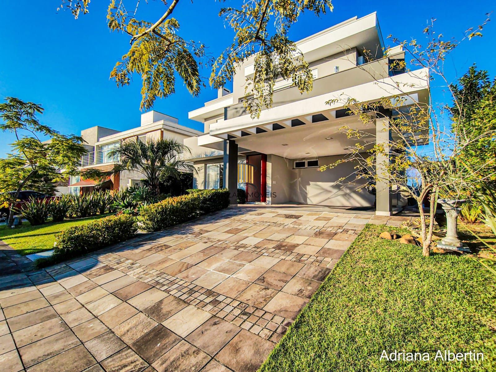 ALPHAVILLE PORTO ALEGRE | CASA COM FUNDOS PARA APP E ÁREA EXTERNA COMPLETA