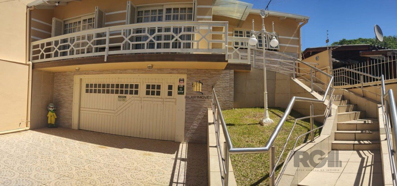 casa com 4 dormitórios, sendo 1 suíte, garagem para dois carros fechada, no bairro Santa Isabel em Viamão